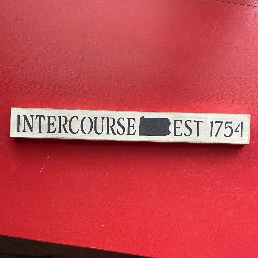 Wooden Sign with Black Text